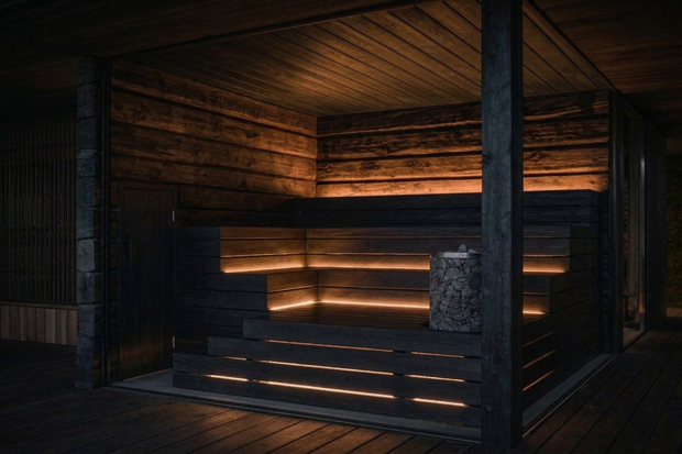 Havainnekuva tummasta saunasta jonka lauteet valasitu